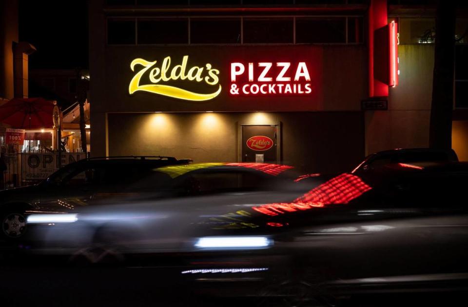 The sign for Zelda’s Original Gourmet Pizza, known for its Chicago-style deep dish pizza for more than 40 years, glows on 21st Street in midtown Sacramento.