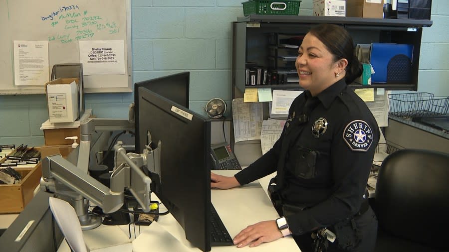 Deputy Lupita Vega at her computer desk