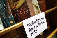 Books by Canadian writer Alice Munro, the 2013 Nobel Prize in Literature winner, are displayed during the book fair in Frankfurt, October 10, 2013. Munro won the Nobel Prize in Literature for being the "master of the contemporary short story," the award-giving body said on Thursday. REUTERS/Ralph Orlowski (GERMANY - Tags: MEDIA BUSINESS ENTERTAINMENT SOCIETY TPX IMAGES OF THE DAY)