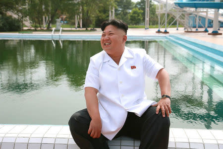 FILE PHOTO: North Korean leader Kim Jong Un gives field guidance during his visit to the Songdowon International Children's Camp in this undated photo released by North Korea's Korean Central News Agency (KCNA) in Pyongyang July 6, 2014. KCNA via REUTERS/File Photo