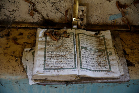 A Quran is seen inside an abandoned mosque in the town of Malakal, in the Upper Nile state of South Sudan, September 9, 2018. REUTERS/Baz Ratner