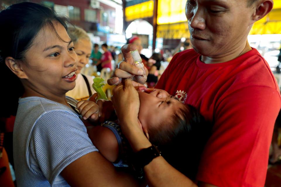 A health worker administers free polio vaccine to a child during a government-led mass vaccination program in Quezon City, Metro Manila, Philippines, October 14, 2019. REUTERS/Eloisa Lopez