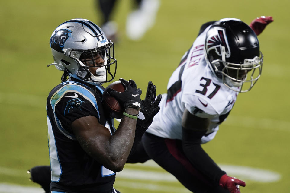 Carolina Panthers wide receiver Curtis Samuel scores past Atlanta Falcons free safety Ricardo Allen during the first half of an NFL football game Thursday, Oct. 29, 2020, in Charlotte, N.C. (AP Photo/Gerry Broome)