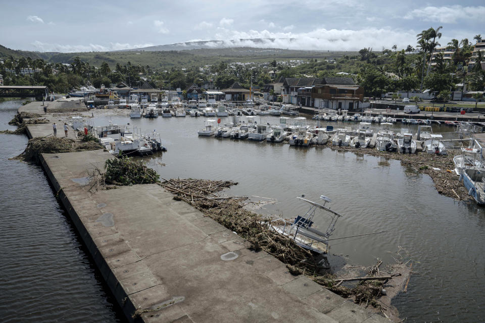 tTrees and debris are seen in the marina of Saint-Gilles les Bains on the French Indian Ocean island of Reunion, Tuesday, Jan. 16, 2024. Tropical cyclone Belal had battered the French island of Reunion, where the intense rains and powerful winds left about a quarter of households without electricity after hitting Monday morning, according to the prefecture of Reunion. (AP Photo/Lewis Joly)