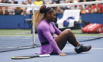 Serena Williams, of the United States, grabs her ankle after falling while chasing a return against Petra Martic, of Croatia, during round four of the US Open tennis championships Sunday, Sept. 1, 2019, in New York. (AP Photo/Sarah Stier)