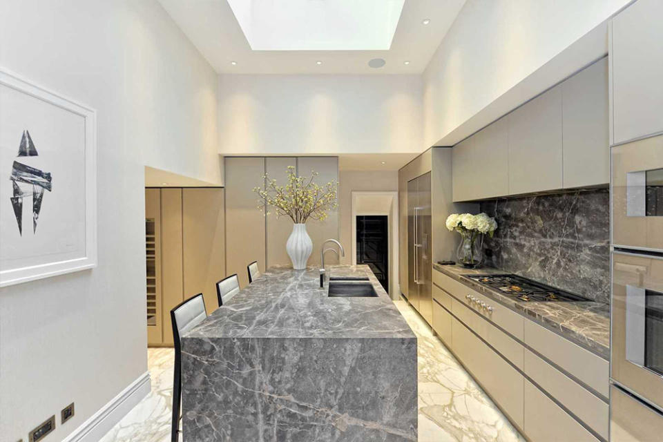 <p>There’s an ultra-modern kitchen with marble benchtops and chef’s gas stovetops. Source: Rokstone </p>