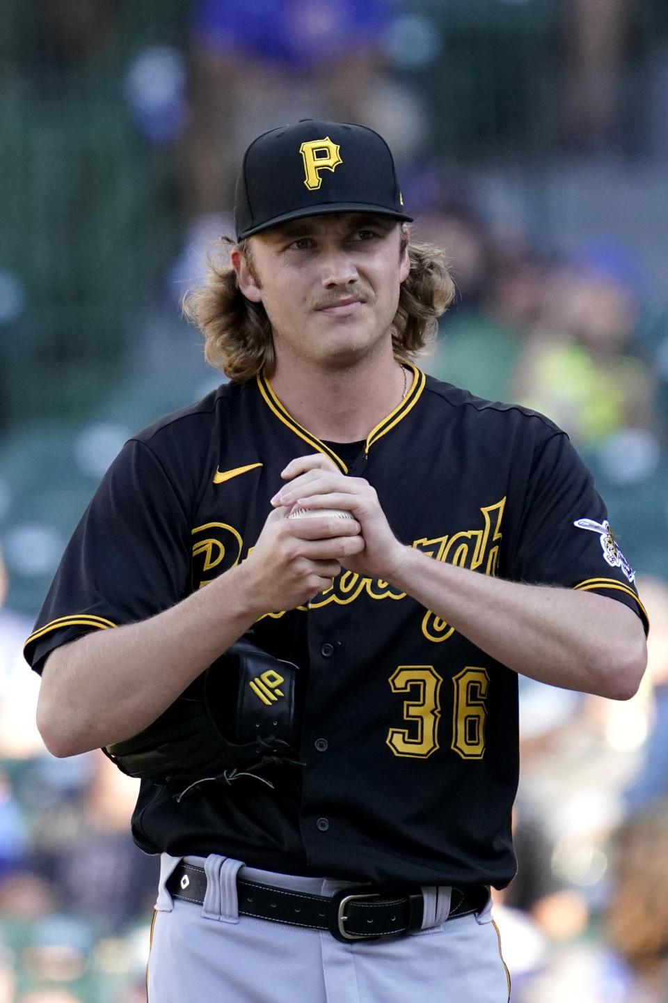 Pittsburgh Pirates relief pitcher Nick Mears rubs the ball during the seventh inning of a baseball game against the Chicago Cubs in Chicago, Sunday, Sept. 5, 2021. (AP Photo/Nam Y. Huh)