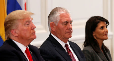 U.S. President Donald Trump (L), Secretary of State Rex Tillerson (C) and Ambassador to the U.N. Nikki Haley (R) attend a working dinner with Latin American leaders in New York, U.S., September 18, 2017. REUTERS/Kevin Lamarque