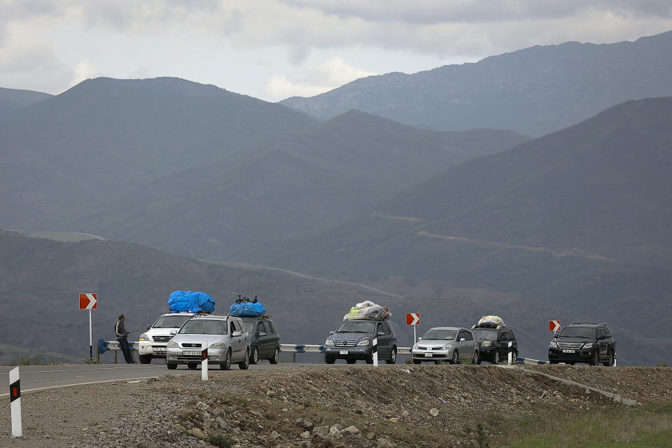FILE - A convoy of cars of ethnic Armenians from Nagorno-Karabakh travel to Kornidzor in Syunik region, Armenia, Sept. 26, 2023. Thousands of Nagorno-Karabakh residents are fleeing their homes after Azerbaijan's swift military operation to reclaim control of the breakaway region after a three-decade separatist conflict. (AP Photo/Vasily Krestyaninov, File)