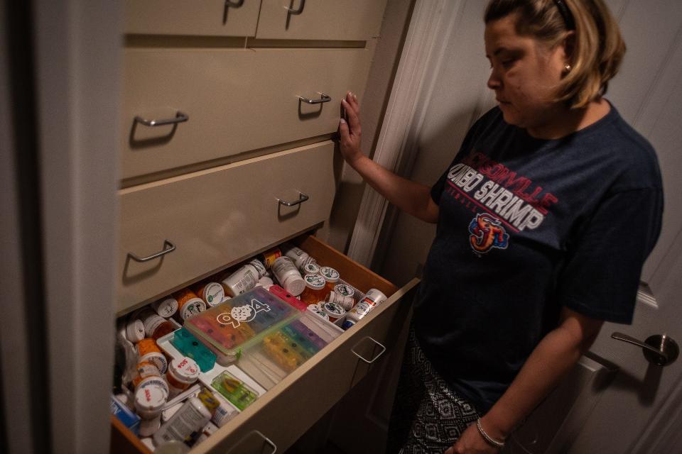 Maria Sanchez at her home with the drawers full of medications in West Palm Beach. Sanchez was born with cystic fibrosis and underwent a double lung transplant in 2019. Medications keep her alive, she said. Her daily anti-rejection drugs will be routine for the rest of her life while other drug treatments treat her diabetes and keep her from getting infections that would likely kill her, she said.