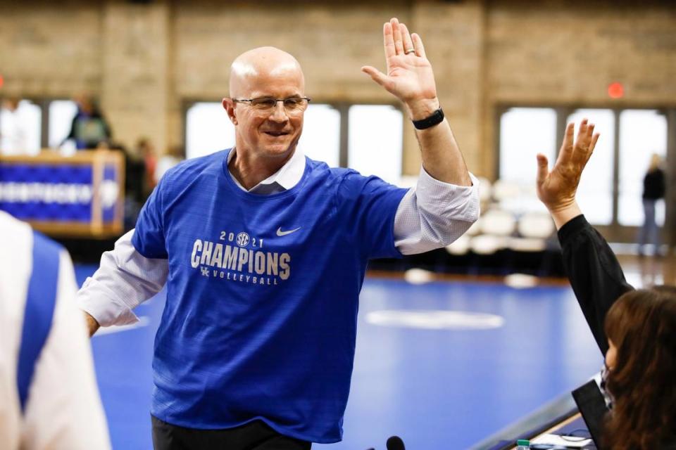 Kentucky volleyball head coach Craig Skinner celebrates after his team won the outright SEC championship for the fall with a three-set win against No. 20 Florida on Nov. 27, 2021.