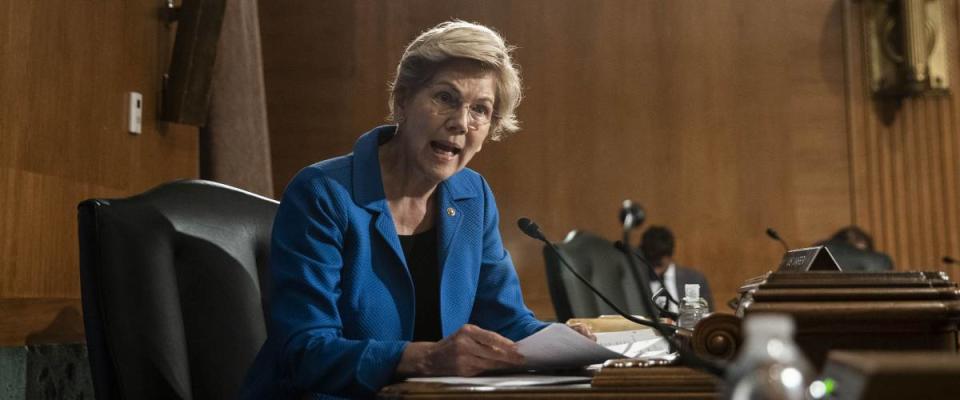 Elizabeth Warren sits in Congress, talking.