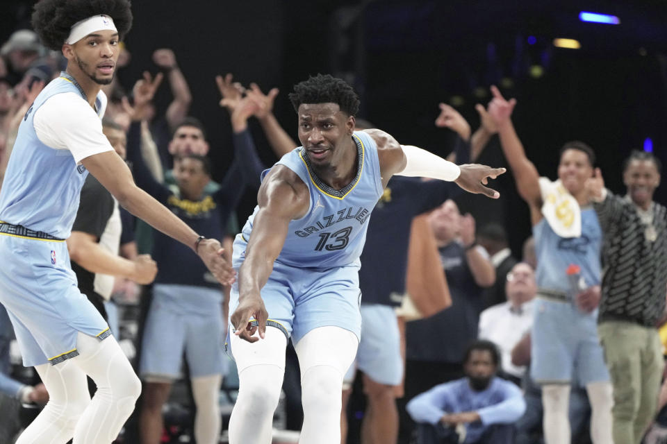 Memphis Grizzlies' Jaren Jackson Jr. (13) reacts after he makes a basket in the second half of Game 5 of an NBA basketball second-round playoff series against the Golden State Warriors Wednesday, May 11, 2022, in Memphis, Tenn. (AP Photo/Karen Pulfer Focht)