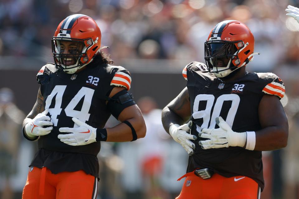 Cleveland Browns defensive tackle Maurice Hurst II (90) celebrates with linebacker Sione Takitaki (44) after recovering a fumble against the Baltimore Ravens on Oct. 1, 2023, in Cleveland.