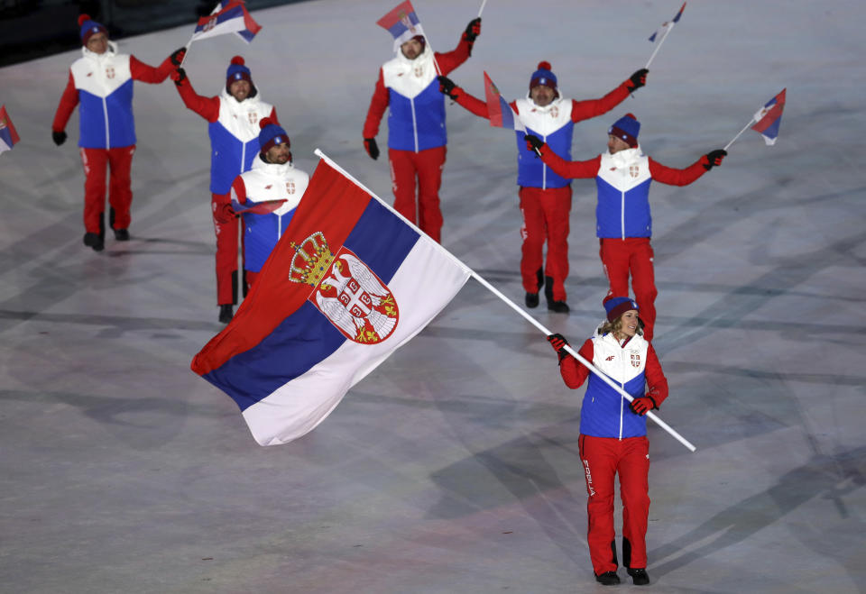 <p>Nevena Ignjatovic carries the flag of Serbia during the opening ceremony of the 2018 Winter Olympics in Pyeongchang, South Korea, Friday, Feb. 9, 2018. (AP Photo/Michael Sohn) </p>