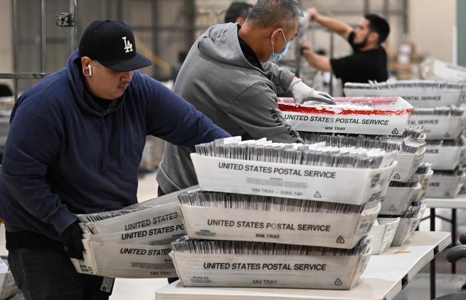 Election workers process vote-by-mail ballots in   Industry, Calif., on Nov. 4, 2022.