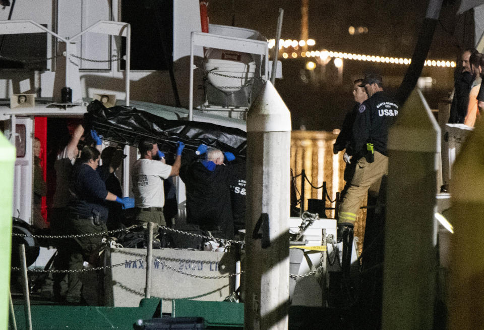 Local law enforcement along with search and rescue teams help unload the bodies of those who died in a diving boat fire, Monday, Sept. 2, 2019, in Santa Barbara, Calif.  (Photo: Christian Monterrosa/AP)