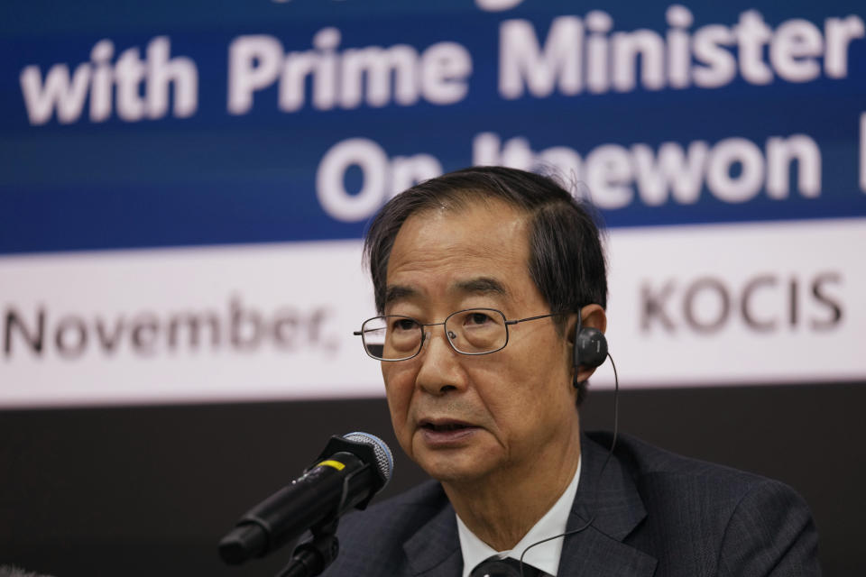 South Korean Prime Minister Han Duck-soo answers a reporter's question during a foreign media briefing in Seoul, South Korea, Tuesday, Nov. 1, 2022. South Korea's police chief admitted "a heavy responsibility" for failing to prevent a recent crowd surge that killed more than 150 people during Halloween festivities in Seoul, saying Tuesday that officers didn't effectively handle earlier emergency calls about the impending disaster. (AP Photo/Lee Jin-man)