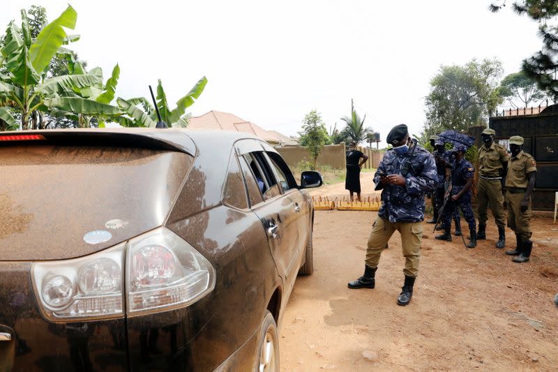 Ugandan police officers refuse lawyers of Ugandan opposition presidential candidate Robert Kyagulanyi from meeting him at his house in Kampala