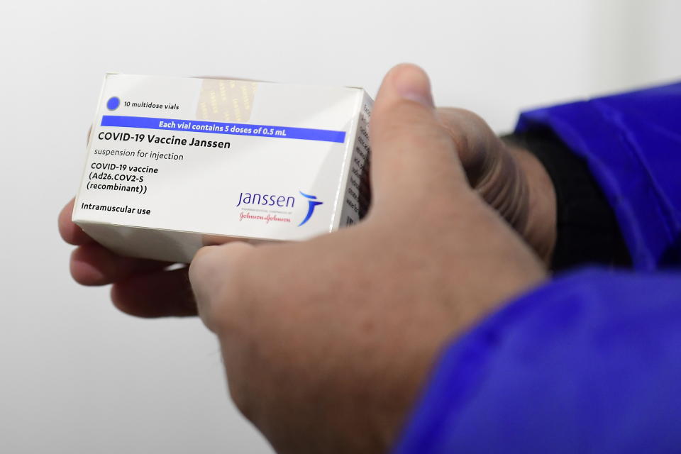 A box of Janssen vaccines is shown by pharmacist Zsolt Szenasi at a warehouse of Hungaropharma, a Hungarian pharmaceutical wholesale company, in Budapest, Hungary, after the arrival of the first batch of the Johnson & Johnson, US, made one-dose vaccine against the new coronavirus in the country Tuesday, April 13, 2021. The first shopment contains 28 thousand doses of Janssen. (Szilard Koszticsak/MTI via AP)