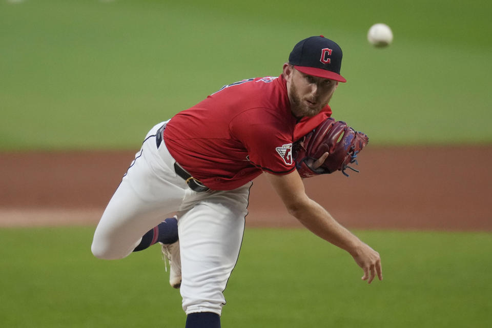 Cleveland Guardians' Tanner Bibee pitches in the first inning of a baseball game against the Cincinnati Reds in Cleveland, Tuesday, Sept. 24, 2024. (AP Photo/Sue Ogrocki)