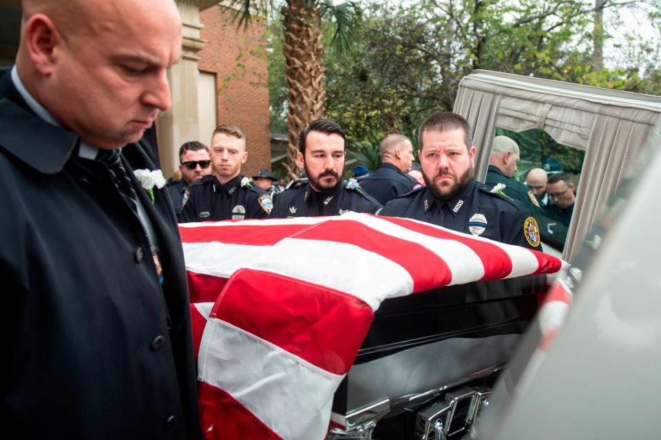 Law enforcement officers carry the caskets of Bay St. Louis police officers Sgt. Steven Robin and Branden Estorffe out to hearses following their funeral at the Bay St. Louis Community Center in Bay St. Louis on Wednesday, Dec. 21, 2022. Robin and Estorffe were killed responding to a call at a Motel 6 on Dec. 14.