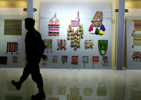 A military officer is seen silhouetted during the inauguration of the Orinoca Museum in Orinoca, Bolivia February 2, 2017. REUTERS/David Mercado