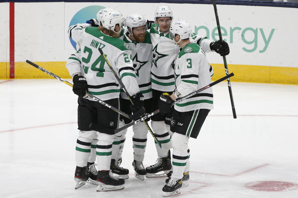 Dallas Stars celebrate a goal against the Columbus Blue Jackets during the second period of an NHL hockey game Tuesday, Feb. 2, 2021, in Columbus, Ohio. (AP Photo/Jay LaPrete)