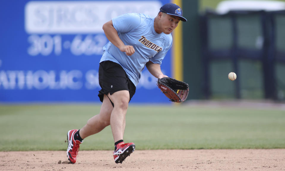Trenton Thunder first baseman Rintaro Sasaki (49) fields a ground ball before a baseball game against the Frederick Keys, Tuesday, June 11, 2024 , in Frederick, Md. The 19-year-old prospect will make his U.S. debut Tuesday in the MLB Draft League, playing for the Trenton Thunder of New Jersey along with others hoping to one day develop into major leaguers.(AP Photo/Daniel Kucin Jr.)