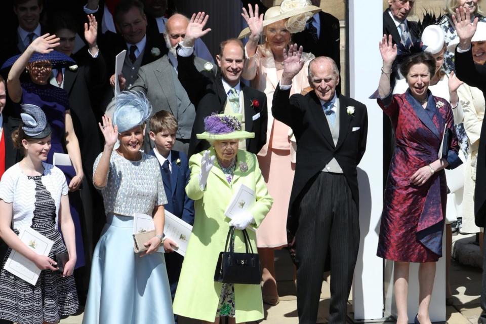 The Queen and the Duke of Edinburgh wave to the crowds at the royal wedding ( Andrew Milligan/WPA Pool/Reuters)