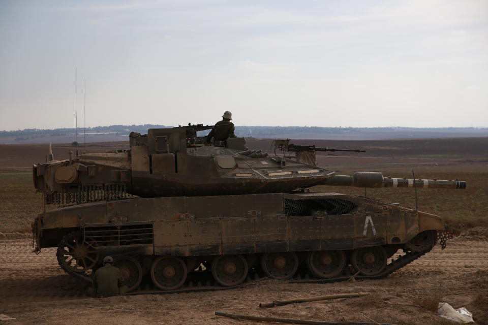 An Israeli tank is seen near the in Israel and Gaza border, Israel, Friday, Oct. 5, 2018. The Israeli military said Thursday it was bolstering its forces along the Gaza border ahead of another expected explosive Hamas-orchestrated protest. (AP Photo/Ariel Schalit)