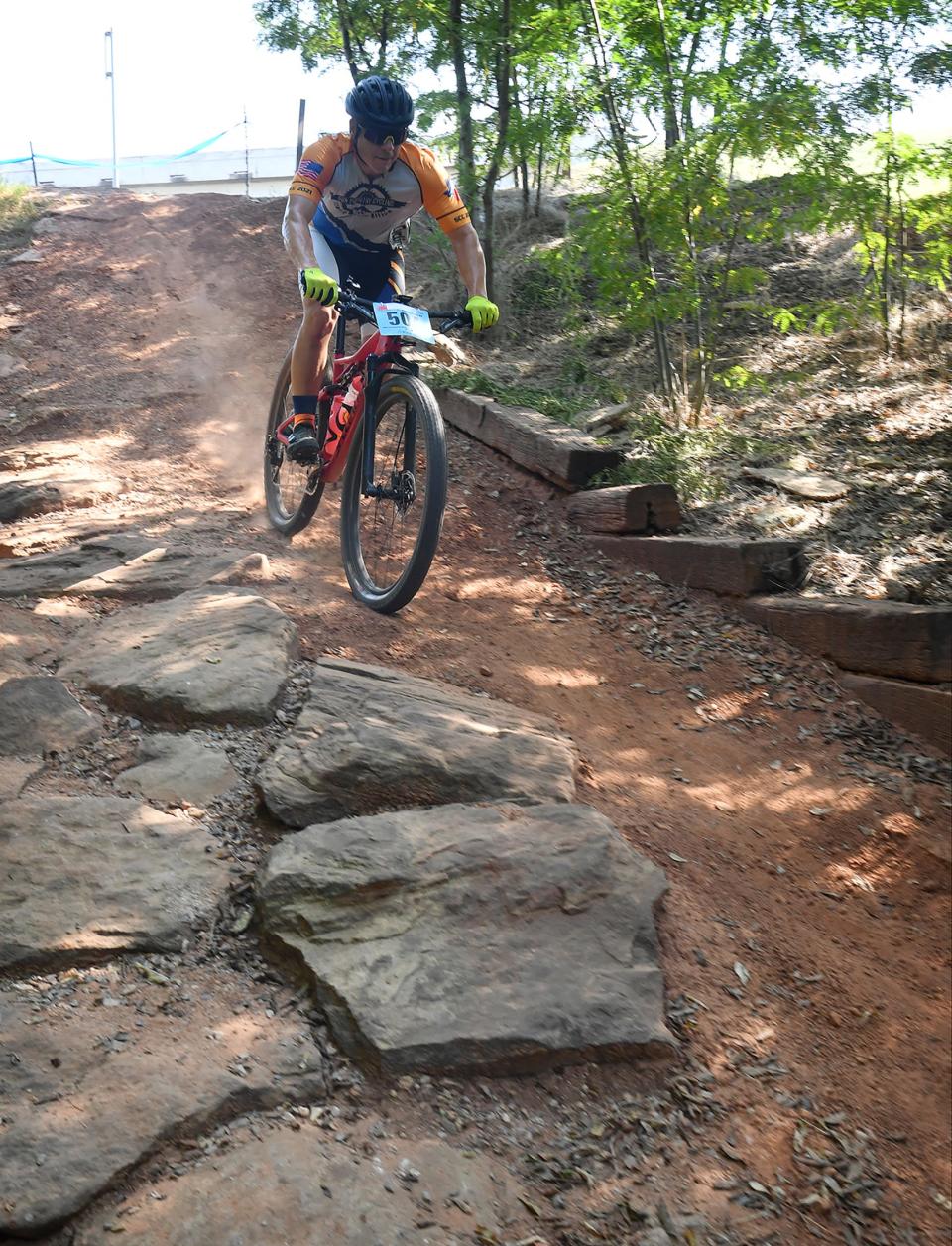 A cyclist races along the Wee-Chi-Tah trail during a Hotter 'N Hell Hundred event. Wichita Falls is known for having great off-road cycling trails.