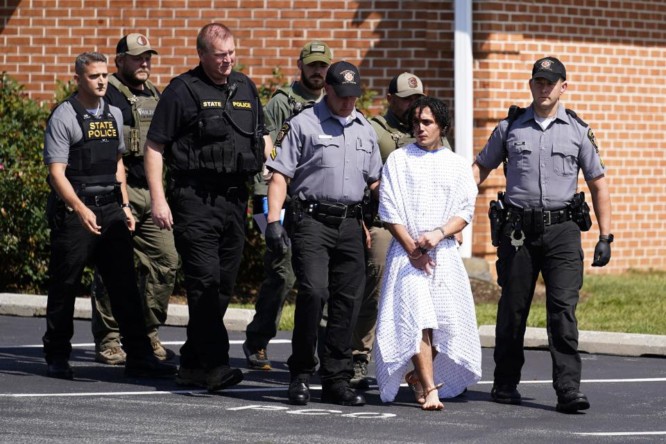 Law enforcement officers escort Danelo Cavalcante from a Pennsylvania State Police barracks in Avondale, Pa., on Wednesday, Sept. 13, 2023. Cavalcante was captured Wednesday after eluding hundreds of searchers for two weeks.