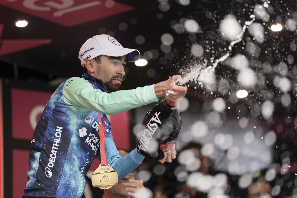 France's Valentin Paret-Peintre celebrates on podium after winning the 10th stage of the Giro d'Italia, Tour of Italy cycling race from Pompei to Cusano Mutri, Italy, Tuesday, May 14, 2024. (Massimo Paolone/LaPresse via AP)