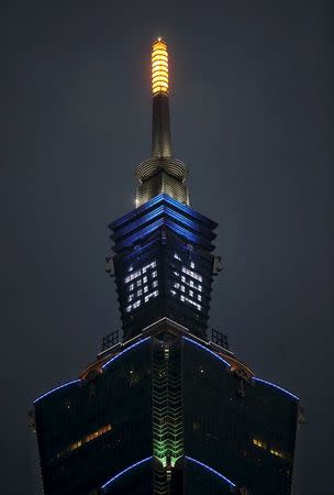 The Chinese characters "Jiayou", which means "Fight on", is displayed on Taiwan's tallest skyscraper, the Taipei 101, after a powerful earthquake hit Tainan, in Taipei, February 6, 2016. REUTERS/Stringer