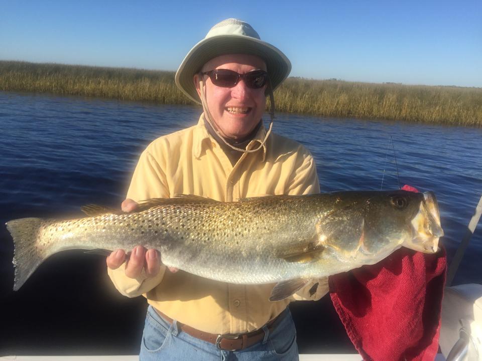 Ron Fye holds up a trophy trout of a lifetime.