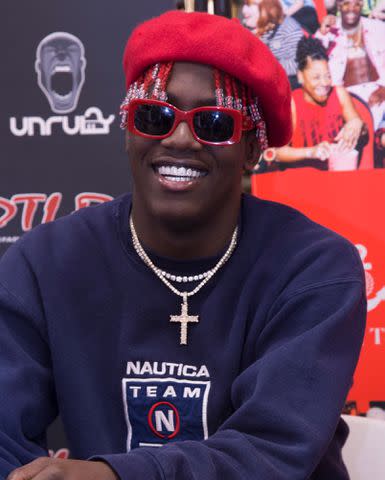 <p>Brian Stukes/Getty</p> Lil Yachty signs copies of his 'Teenage Emotions' on May 30, 2017 in Columbia, Maryland.