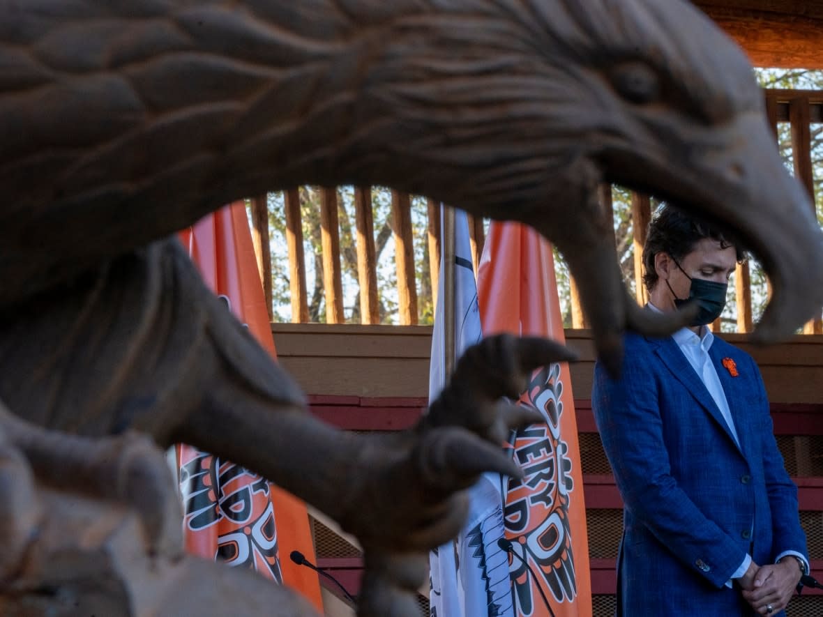 Prime Minister Justin Trudeau is framed by a eagle statue as he visits Tk’emlups the Sewepemc in Kamloops, B.C. Monday, Oct. 18, 2021. (Jonathan Hayward/The Canadian Press - image credit)