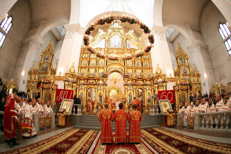 Orthodox priests pray during a service at the Svyato-Preobrazhensky cathedral in the eastern Ukrainian city of Donetsk, on May 7, 2011