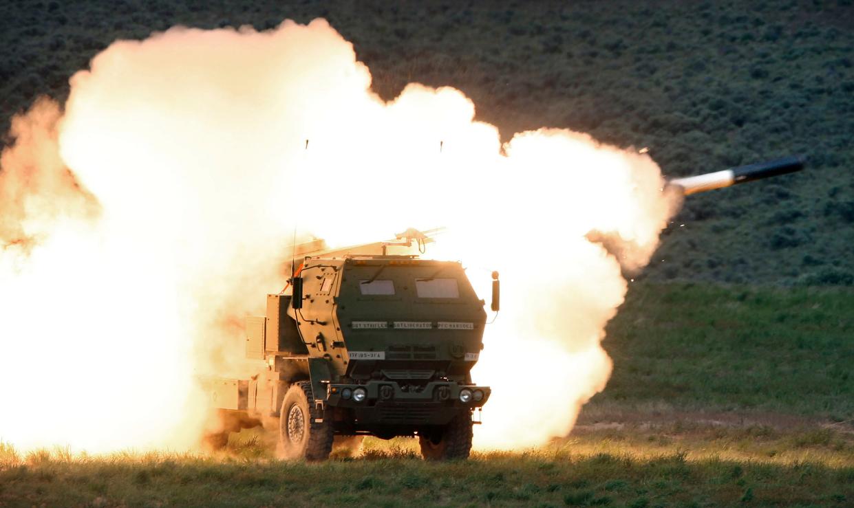 FILE - A launch truck fires the High Mobility Artillery Rocket System (HIMARS) produced by Lockheed Martin during combat training in the high desert of the Yakima Training Center, Washington in May 23, 2011. The HIMARS systems supplied by the U.S. and similar M270 provided by Britain have significantly bolstered the Ukrainian army's precision strike capability. The deliveries of Western arms have been crucial for Ukraine’s efforts to fend off Russian attacks in the nearly 5-month-old war. 