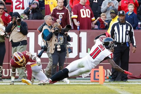 Atlanta Falcons wide receiver Julio Jones (11) breaks the tackle attempt of Washington Redskins free safety Ha Ha Clinton-Dix (20) to score a touchdown in the fourth quarter at FedEx Field - Credit: Geoff Burke/USA Today