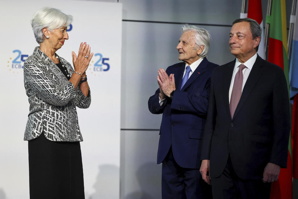 European Central Bank president Christine Lagarde, left, welcomes her predecessors, Mario Draghi, right, and Jean-Claude Trichet during a ceremony to celebrate the 25th anniversary of the ECB, in Frankfurt, Germany, Wednesday May 24, 2023. (Kai Pfaffenbach/Pool via AP)