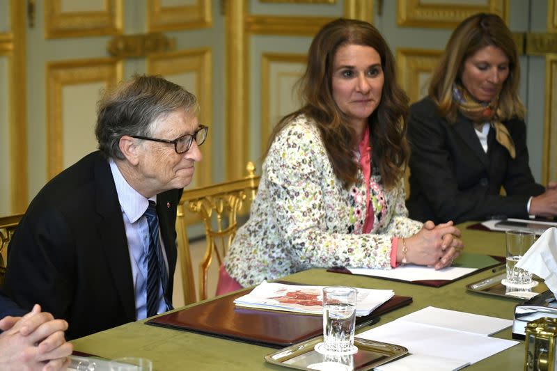 FILE PHOTO: Microsoft founder and billionaire philanthropist Bill Gates and his wife Melinda Gates attend a meeting with French President at the Elysee Palace in Paris