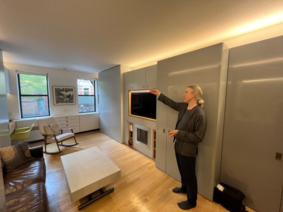 Robert Garneau stands in the apartment. 