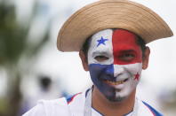 <p>A Panamanian football fan proudly displays the white, blue and red of the World Cup debutants. (Getty) </p>