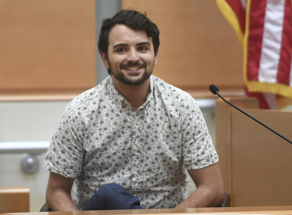 Matthew Soto smiles as he talks about his sister, deceased Sandy Hook Elementary School teacher Victoria Soto, during his testimony in Alex Jones' defamation trial at Superior Court in Waterbury, Conn., on Thursday, Sept. 29, 2022. (Brian A. Pounds/Hearst Connecticut Media via AP, Pool)