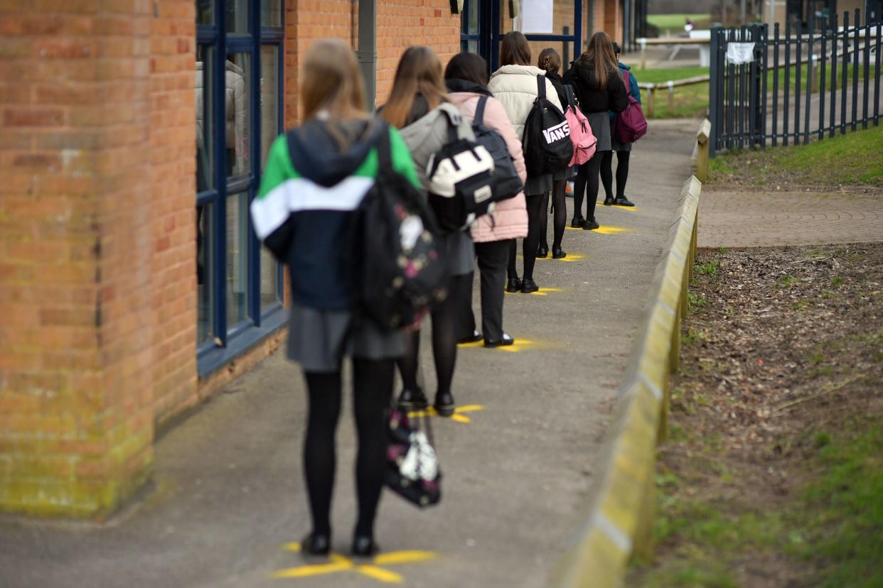 Pupils queuing to take a lateral flow test at Archway School in Stroud, Gloucestershire, in March this year (PA)