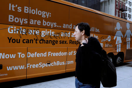 FILE PHOTO: A man looks at the damage to the "Free Speech Bus," after it was attacked near the United Nations Headquarters in New York City, U.S., March 23, 2017. REUTERS/Brendan McDermid/File Photo