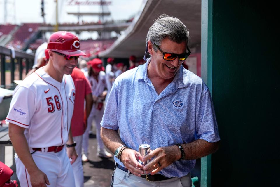 Reds president and CEO Phil Castellini visits the dugout prior to the start of the first inning of the MLB National League game between the Cincinnati Reds and the Colorado Rockies at Great American Ball Park in downtown Cincinnati on Wednesday, June 21, 2023. The game was tied 3-3 after five innings.