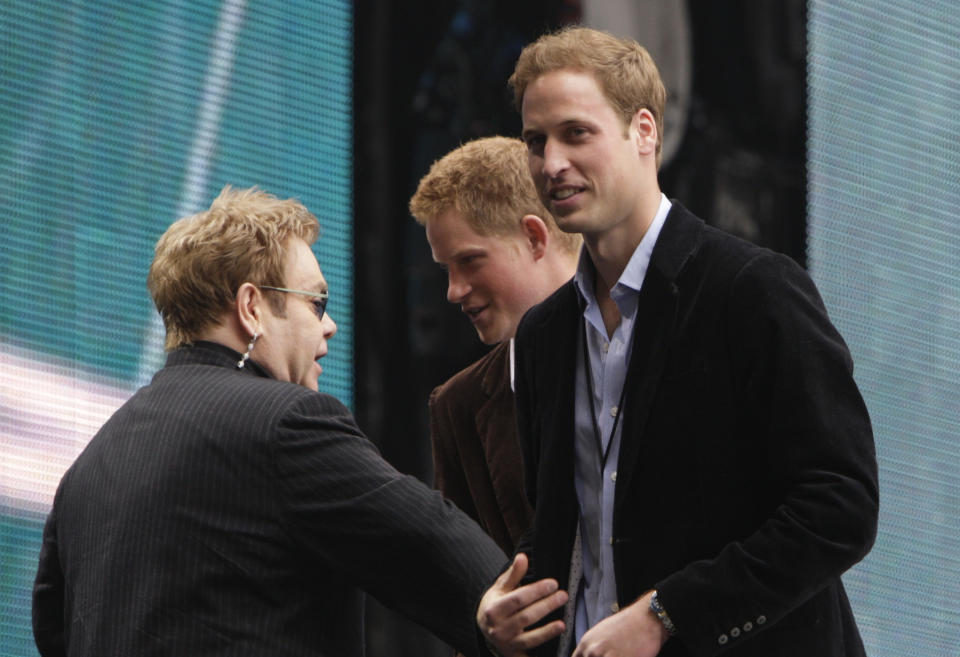 CONCERT FOR DIANA -- Pictured: (l-r) Singer Elton John speaks with Prince Harry and Prince William on stage during the "Concert for Diana" held at Wembley Stadium, Wembley, London, England on July 1, 2007  (Photo by Edmond Terakopian/NBCU Photo Bank/NBCUniversal via Getty Images via Getty Images)